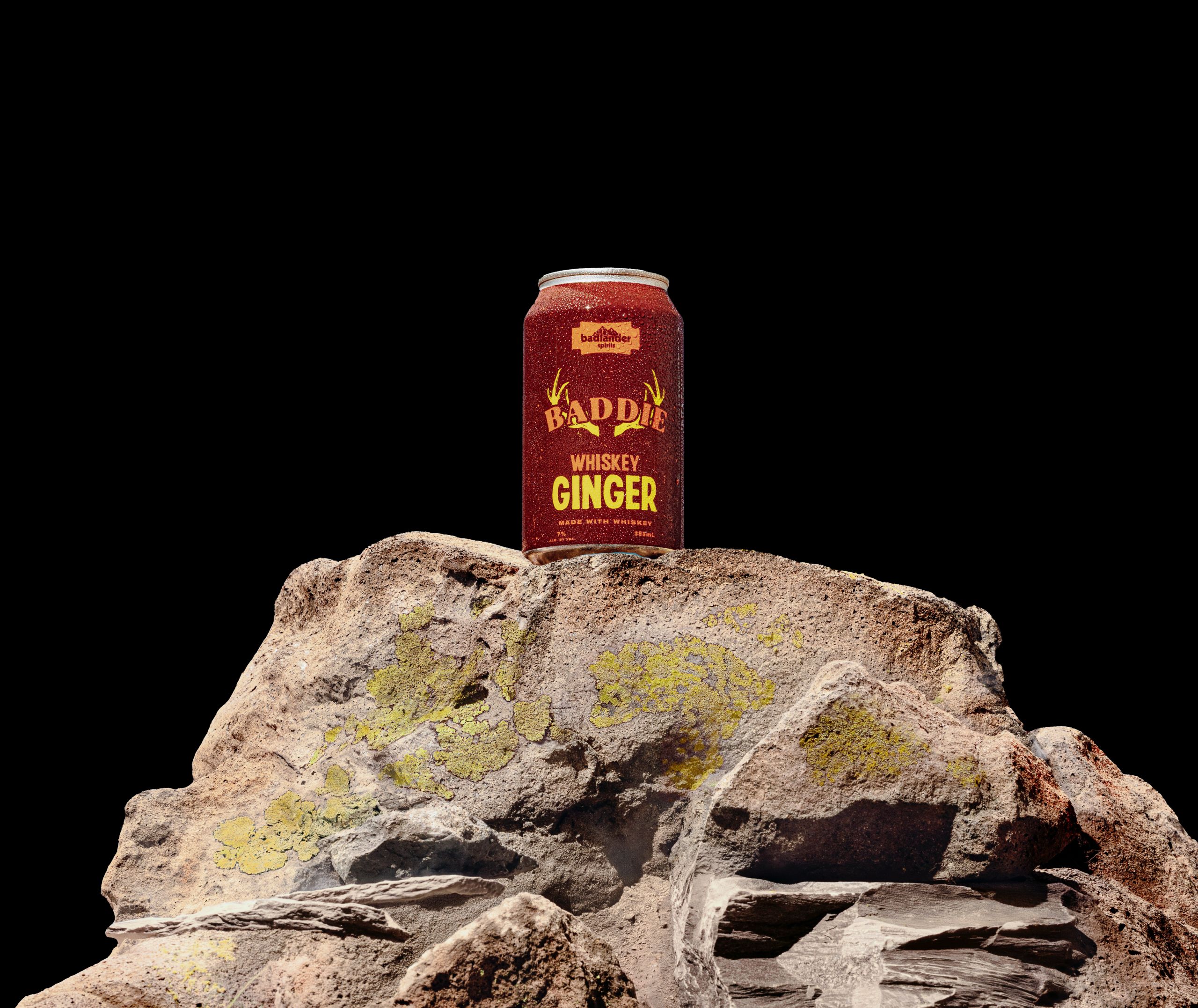 Badlander Whiskey Ginger canned cocktail on a rock.